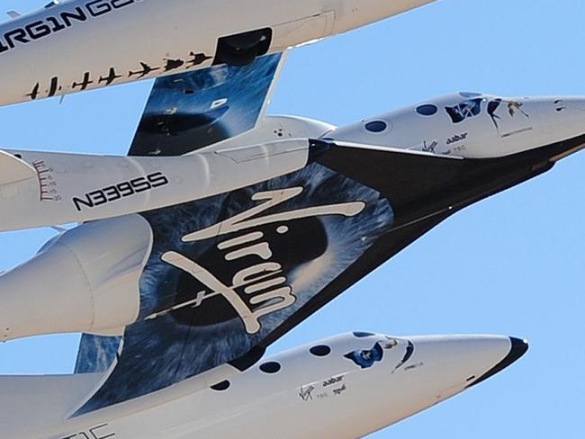 WhiteKnightTwo, carrying SpaceShipTwo, takes flight over Spaceport America, northeast of Truth Or Consequences, on October 17, 2011 in New Mexico. Sir Richard Branson was on hand to host the Keys To A New Dawn event, for the dedication of Virgin Galactic's new home at Spaceport America, the world's first purpose-built commercial spaceport in southern New Mexico, where the Spaceport America Terminal Hangar Facility will serve as the operating hub for Virgin Galactic and is expected to house two WhiteKnightTwos and five SpaceShipTwos, in addition to all of Virgin's astronaut preparation facilities and mission control. AFP PHOTO / Frederic J. BROWN