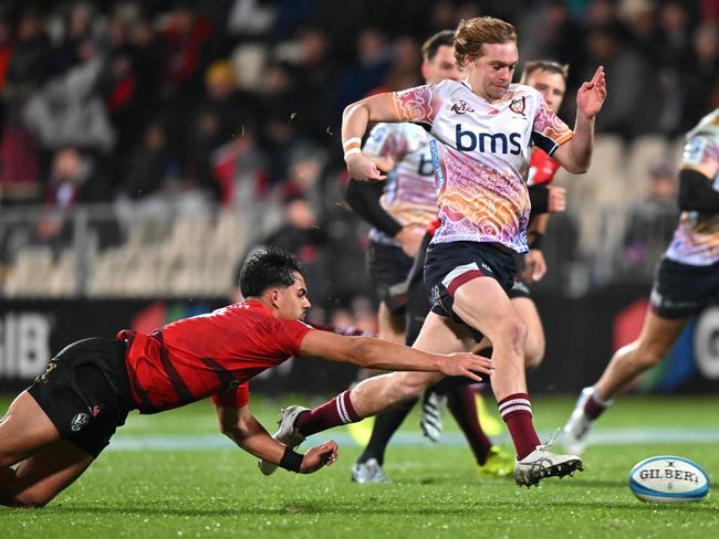 Tim Ryan kicks ahead for Queensland. Picture: Getty Images
