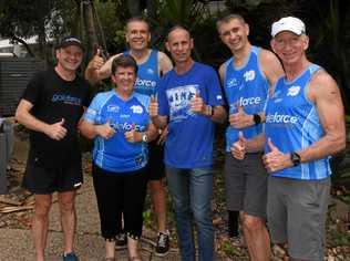 GET SET: Steve Moneghetti (centre) with Chris Gale (left) and the Galeforce runners in Sunshine Beach. Picture: Peter Gardiner