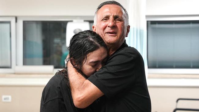 Noa Argamani, 26, being hugged by a relative at the Sheba Tel-HaShomer Medical Centre, after her rescue from the Gaza Strip. Picture: AFP