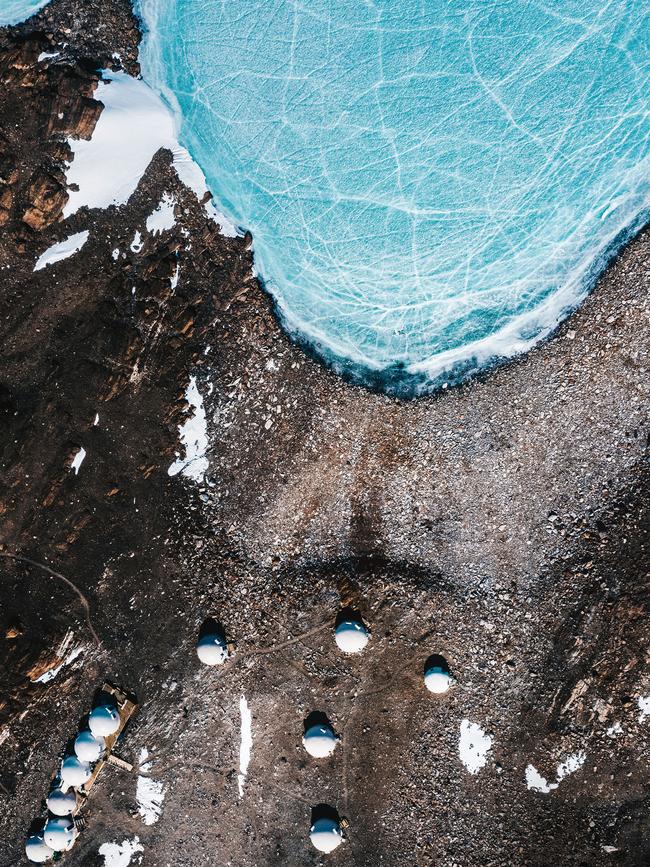 The pods of the camp next to a frozen lake. Picture: Tom Parker