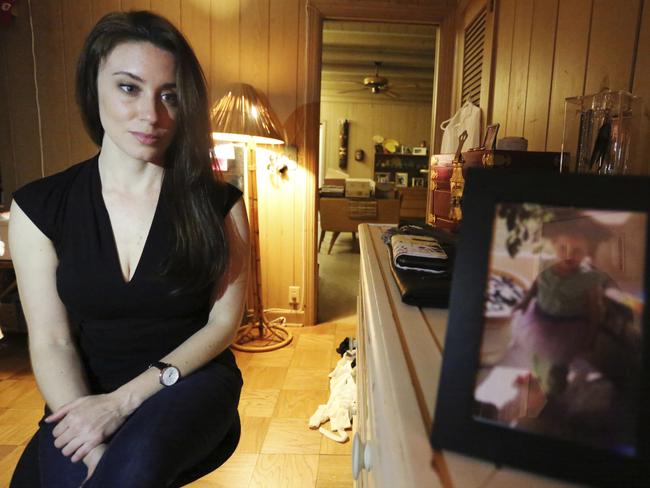 Casey Anthony poses for a portrait next to a photo of her daughter, Caylee, in her West Palm Beach, Florida, bedroom. Picture: AP