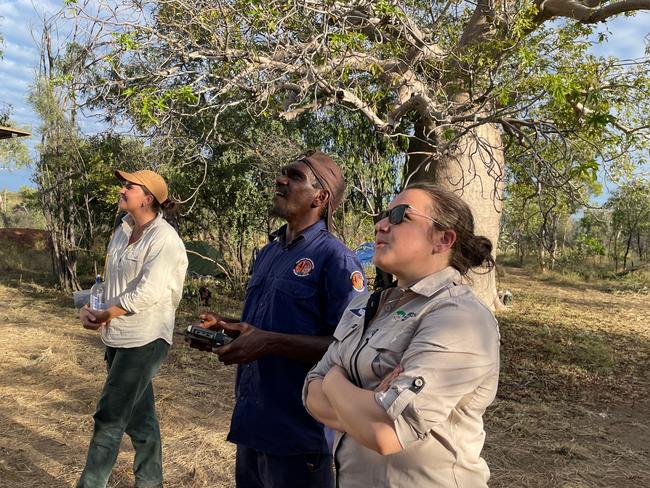 Nyikina Mangala Ranger Tyrese Skeen improving his drone skills with training from pilots Rebecca Rogers and Aliehsa Hvala.