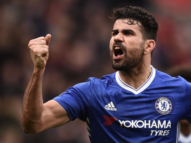 Chelsea's Brazilian-born Spanish striker Diego Costa celebrates their second goal during the English Premier League football match between Stoke City and Chelsea at the Bet365 Stadium in Stoke-on-Trent, central England on March 18, 2017. / AFP PHOTO / Oli SCARFF / RESTRICTED TO EDITORIAL USE. No use with unauthorized audio, video, data, fixture lists, club/league logos or 'live' services. Online in-match use limited to 75 images, no video emulation. No use in betting, games or single club/league/player publications.  /