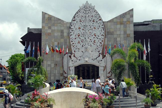 Foreign tourists visit the monument dedicated to the victims of the 2002 Bali bombings in the Kuta section of Denpasar in Bali, Indonesia.