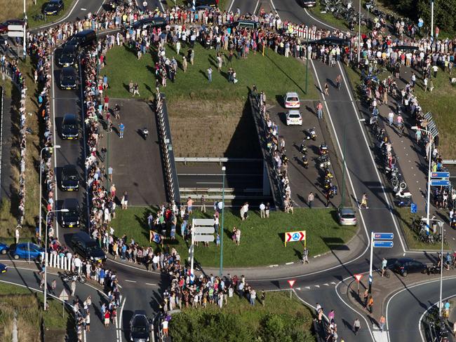 Mourners gather to pay their respects to the convoy of hearses carrying the bodies of victims MH17 in the Netherlands. Picture: Jerry Lampen