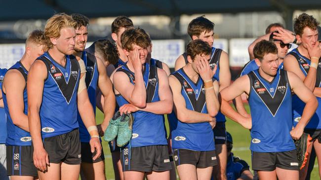 Unley players ponder their grand final loss after the final siren. Picture: Brenton Edwards