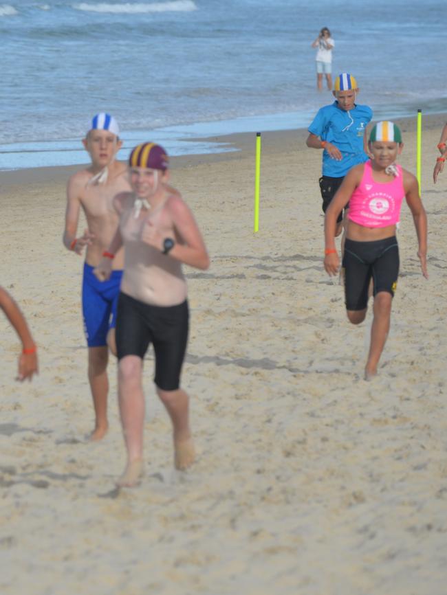 Running action at the Queensland Youth Surf Life Saving Championships on February 17.