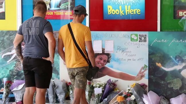 Flowers, handwritten notes and other items left by the friends of Jack Beasley at Surfers Paradise. Picture: Liam Kidston.