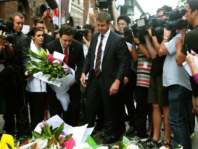NSW Premier Mike Baird at the flower memorial.