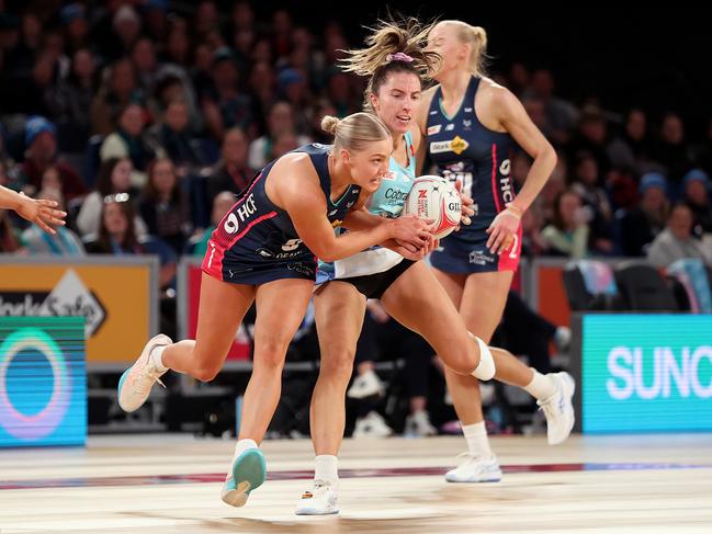 Kate Moloney (c) helped steer the Vixens to a derby win. Picture: Getty