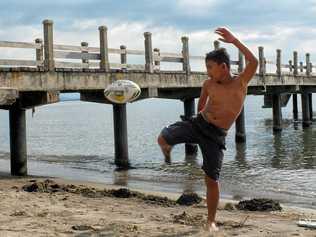 Rob Williams has given the gift of footballs donated by the Ipswich Jets Rugby League Club to kids around the world. Lovina Beach, Bali, Indonesia. Picture: Rob Williams