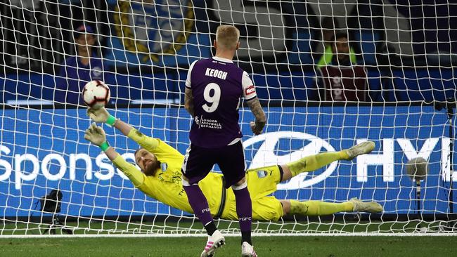 Andrew Redmayne dives to his right to save Andy Keogh’s penalty kick. Picture: Getty Images