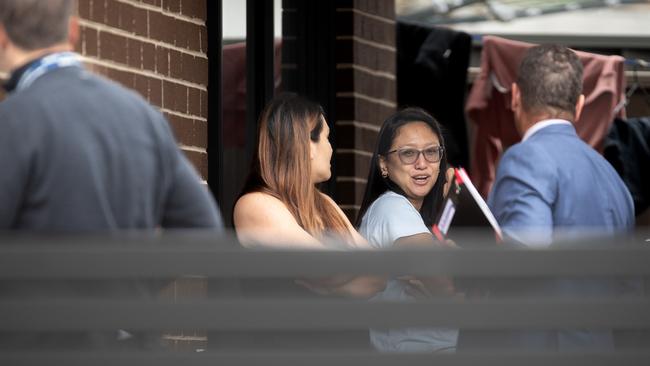 Police talk to Anne Carlos and her sister Lara, who found the baby. Picture: Julian Andrews