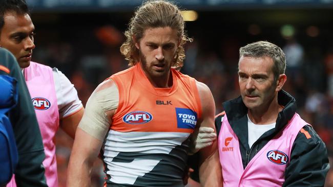 Callan Ward is helped off the preliminary final. Picture. Phil Hillyard