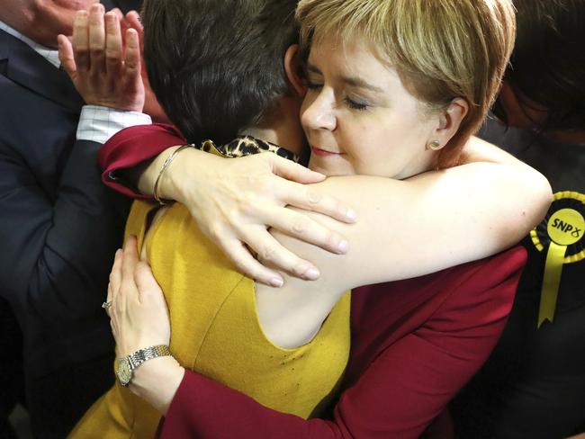 Scotland’s First Minister Nicola Sturgeon is embraced as she arrives at the Emirates Arena in Glasgow. Picture: Andrew Milligan/PA via AP