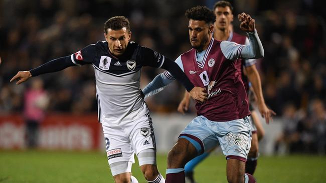 Kosta Barbarouses comes in for some close attention from the APIA defence.