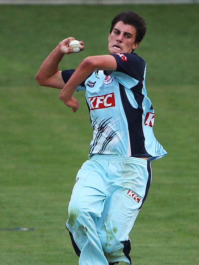 Cummins steams in for NSW during a state game.