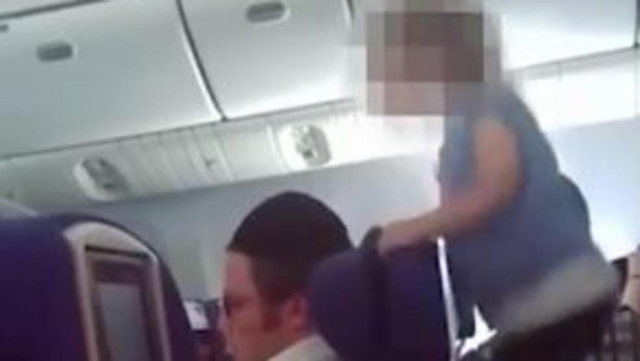 Airplane Passenger Puts Bare Feet On Tray Table - Travel Noire