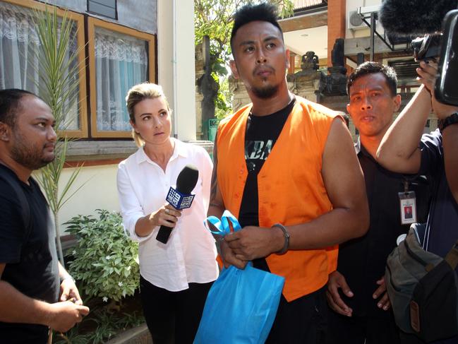 The accused carried his belongings in a plastic bag. Picture: Lukman S. Bintoro