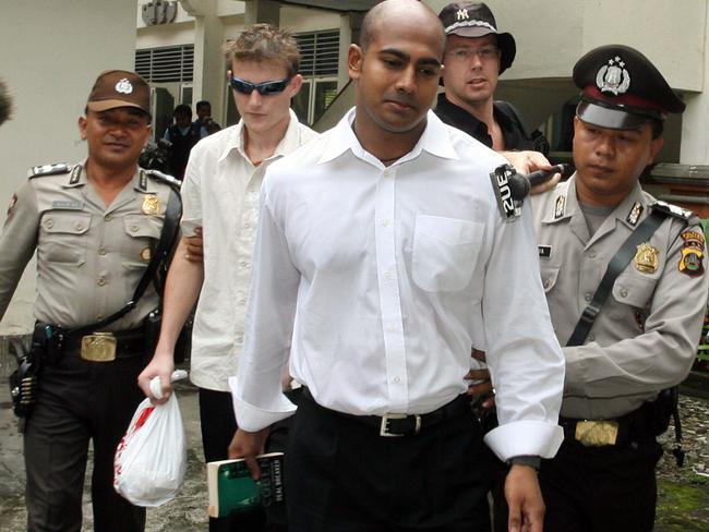 Myuran Sukumaran and Michael Czugaj escorted by police outside Denpasar Courthouse in 2006. Prosecutor ordered the death sentence for Sukumaran and life for Czugaj.