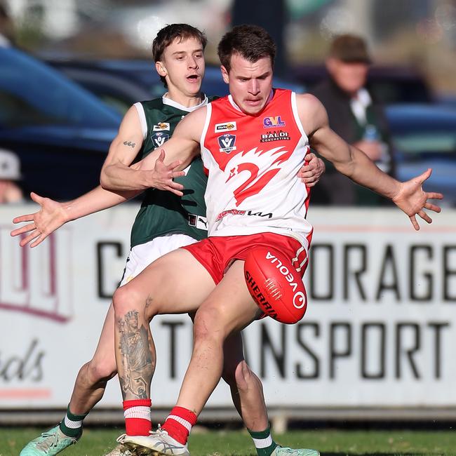 Shepparton Swans’ Luke Davies is tackled without the ball by Echuca’s Makai Cronin.