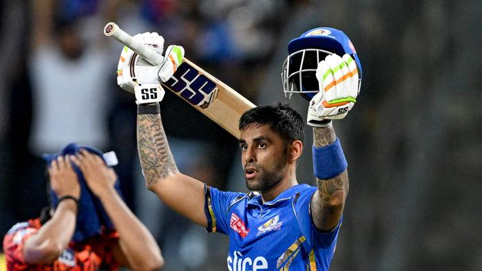 Mumbai Indians' Suryakumar Yadav (R) celebrates after scoring a century (100 runs) as his team wins against Sunrisers Hyderabad at the end of their Indian Premier League (IPL) Twenty20 cricket match in the Wankhede Stadium of Mumbai on May 6, 2024. (Photo by Punit PARANJPE / AFP) / — IMAGE RESTRICTED TO EDITORIAL USE – STRICTLY NO COMMERCIAL USE —