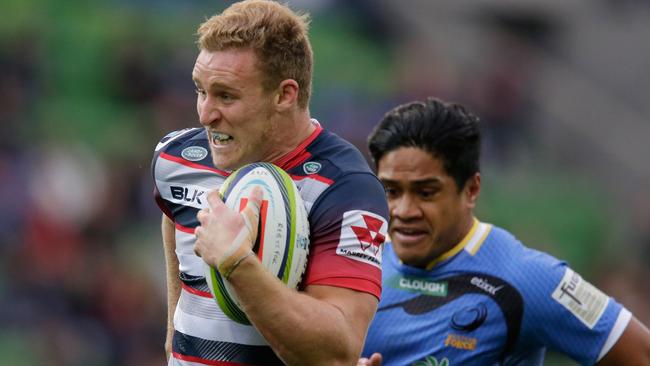 MELBOURNE, AUSTRALIA - MAY 29: Reece Hodge of the Rebels breaks through for a try during the round 14 Super Rugby match between the Rebels and the Force at AAMI Park on May 29, 2016 in Melbourne, Australia. (Photo by Darrian Traynor/Getty Images)