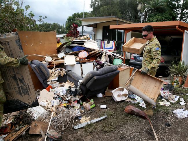 WEEKEND TELEGRAPHS SPECIAL. MUST TALK WITH PIC ED JEFF DARMANIN BEFORE PUBLISHING.  NSW mid north coast flood disaster. An army of volunteers from the ADF 6th Battalion RAR from Brisbane help clean up continues at the Riverside Village Residential Park on Hastings River Drive, Port Macquarie   Nathan Edwards