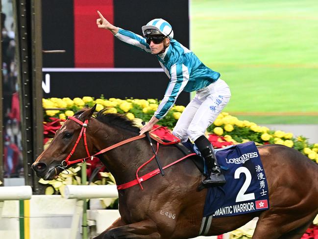 James McDonald celebrates as Romantic Warrior wins the Group 1 Hong Kong Mile. Picture: Grant Peters-Trackside Photography.