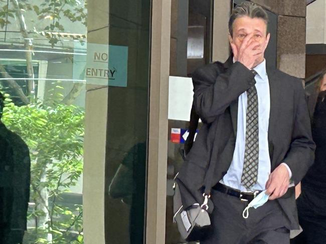 Chiropractor Ian Deitch, left, leaves Melbourne Magistrates' Court with his lawyer Simon Kenny, right, during a break in proceedings.