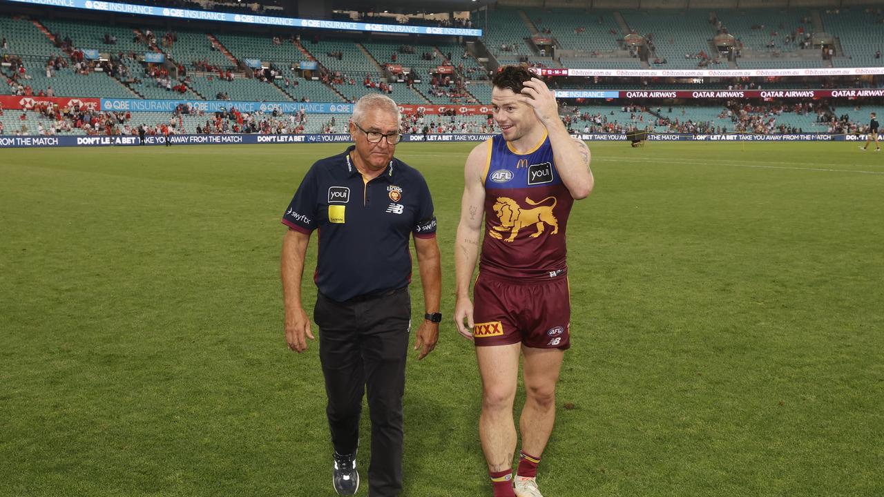 Chris Fagan, coach of the Brisbane Lions chats with Lachie Neale. Photo by Darrian Traynor/AFL Photos/via Getty Images.