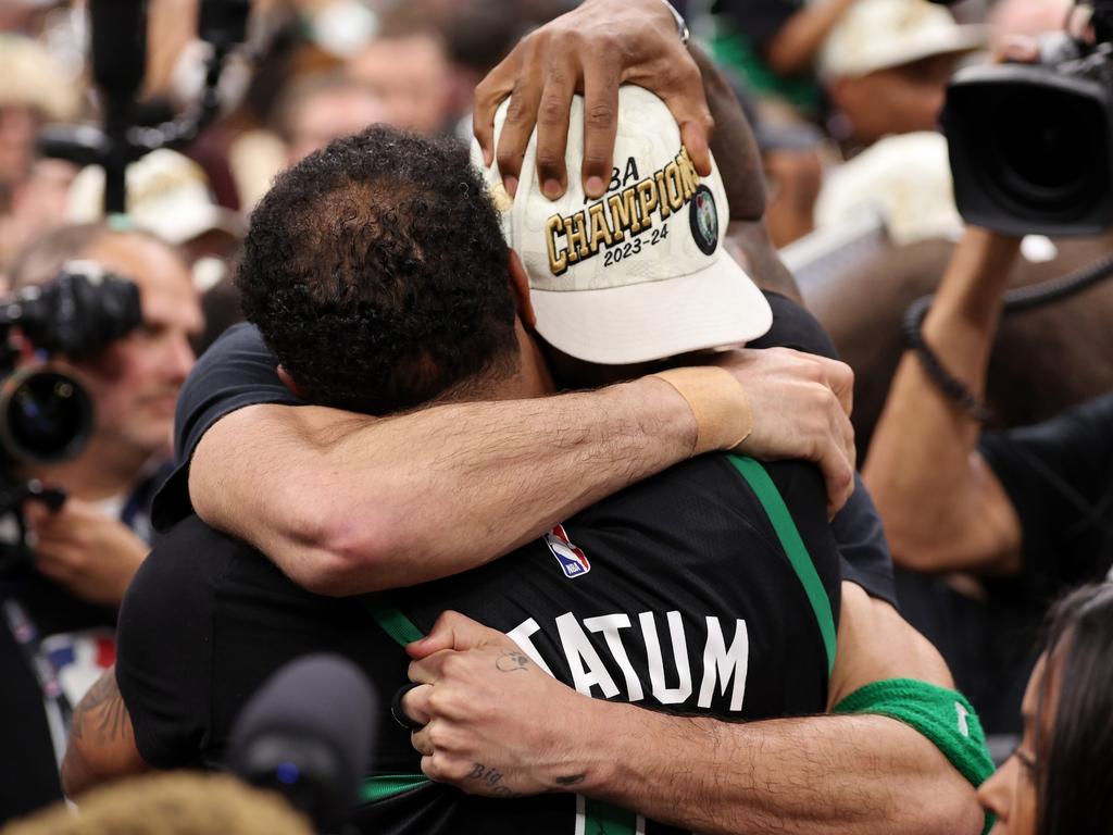 Jayson Tatum hugs his father, Justin Tatum, after Boston's championship win. Picture: Getty Images