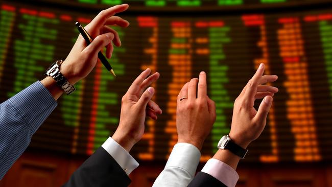 Share price, bull, bear, shares, stocks. Hands raised into the air and electronic stock market board.