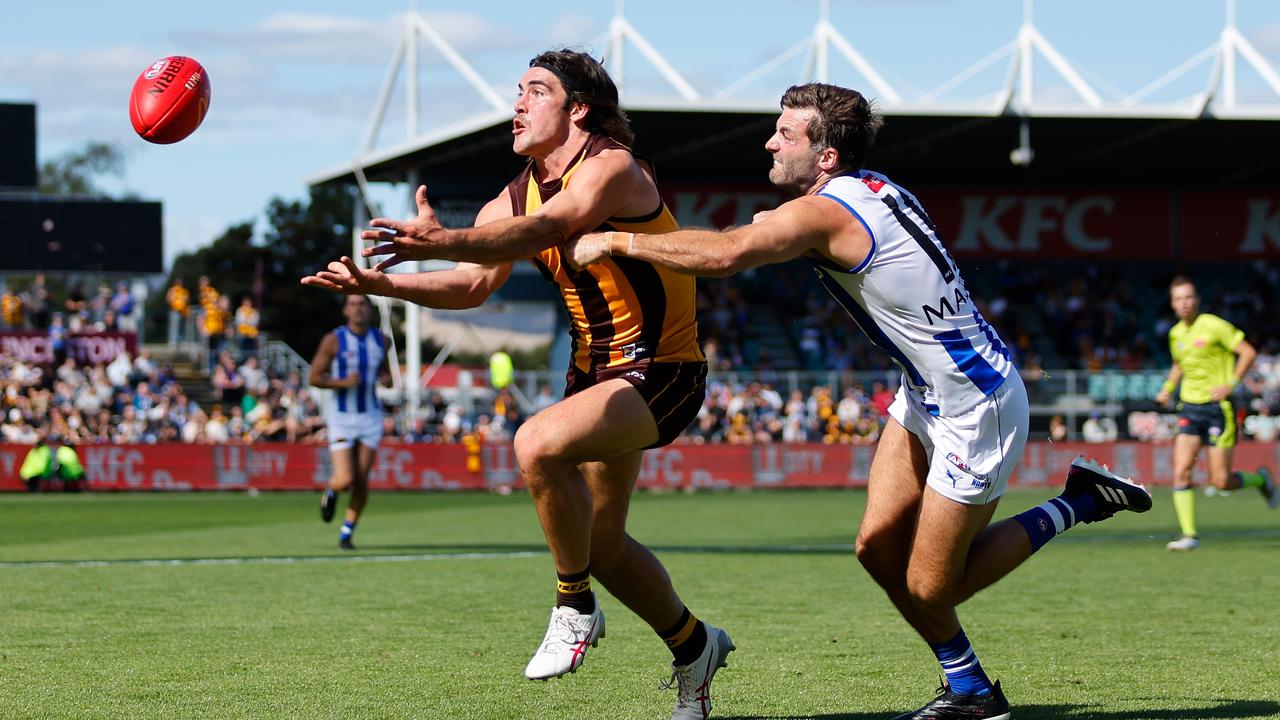 LAUNCESTON, AUSTRALIA - APRIL 01: Jai Newcombe of the Hawks and Luke McDonald of the Kangaroos compete for the ball during the 2023 AFL Round 03 match between the Hawthorn Hawks and the North Melbourne Kangaroos at UTAS Stadium on April 1, 2023 in Launceston, Australia. (Photo by Dylan Burns/AFL Photos via Getty Images)