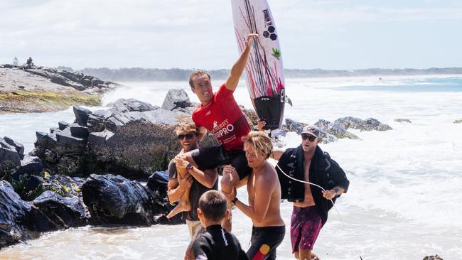 Jordan Lawler being chaired from the beach after taking out the Tweed Coast Pro. (Photo by Cait Miers/World Surf League)