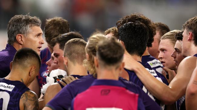 PERTH, AUSTRALIA - MAY 24: Justin Longmuir, Senior Coach of the Dockers addresses the team at the quarter time break during the 2024 AFL Round 11 match between Walyalup (Fremantle) and the Collingwood Magpies at Optus Stadium on May 24, 2024 in Perth, Australia. (Photo by Will Russell/AFL Photos via Getty Images)