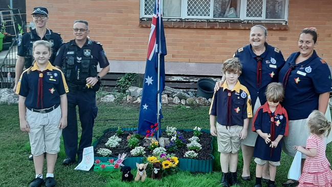 Robert Kaden from Marsden Scouts with his family and the members of Logan Central Police.