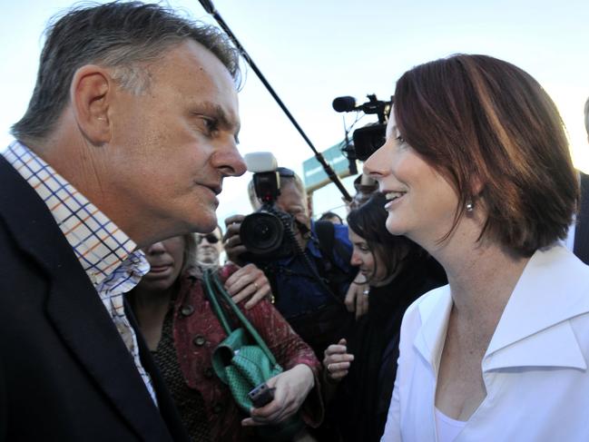 Prime Minister Julia Gillard speaks to former opposition leader Mark Latham on the campaign trail at the Ekka in Brisbane, August 2010. Mr Latham was making a 60 minutes television segment. Picture: AAP