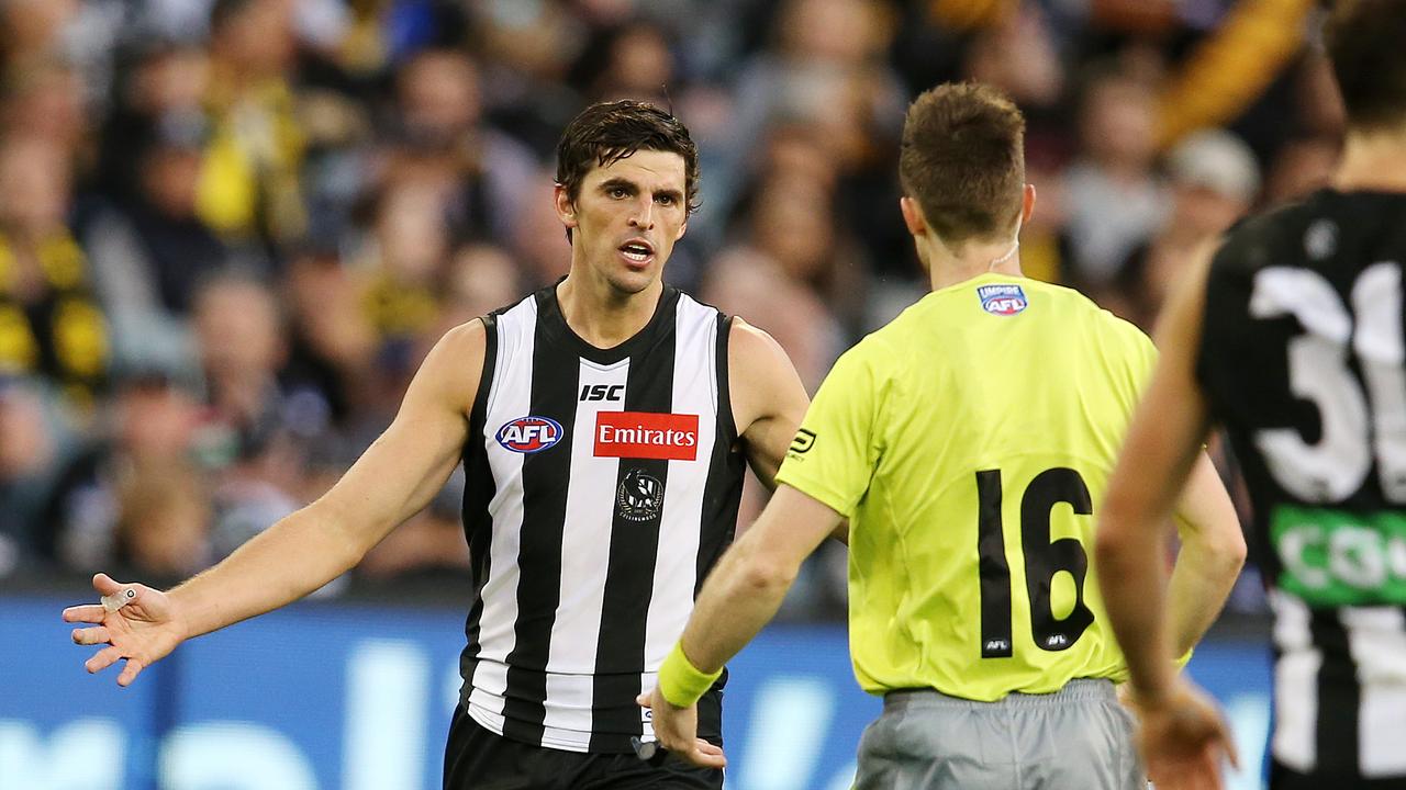 Collingwood's Scott Pendlebury talks with the umpire after giving away a 50m penalty. Picture: Michael Klein