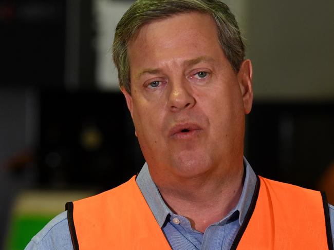 Queensland OppositIon Leader Tim Nicholls (centre), flanked by the LNP candidate for Pine Rivers Chris Thompson (right) and the LNP candidate for Bancroft Kara Thomas, speaks at a press conference at Berg Engineering in Brisbane, Saturday, November 18, 2017. Mr Nicholls is on the campaign trail ahead of the November 25 state election. (AAP Image/Dan Peled) NO ARCHIVING