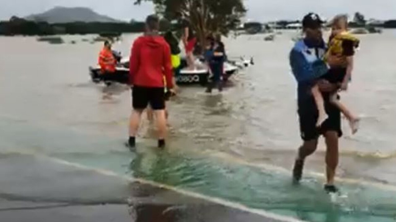 Antonio Winterstein and John Asiata help rescue Townsville floods victims.