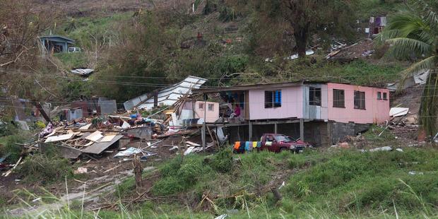 One house survives, the other taken, in the town of Rakiraki, after Cyclone Winston hit Fiji. . Picture: Brett Phibbs