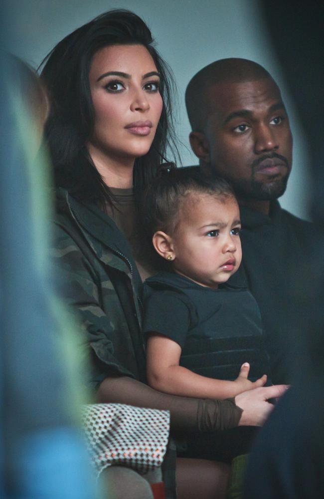 Kim Kardashian, with North on her lap, and Kanye West. Picture: AP Photo/Bebeto Matthews