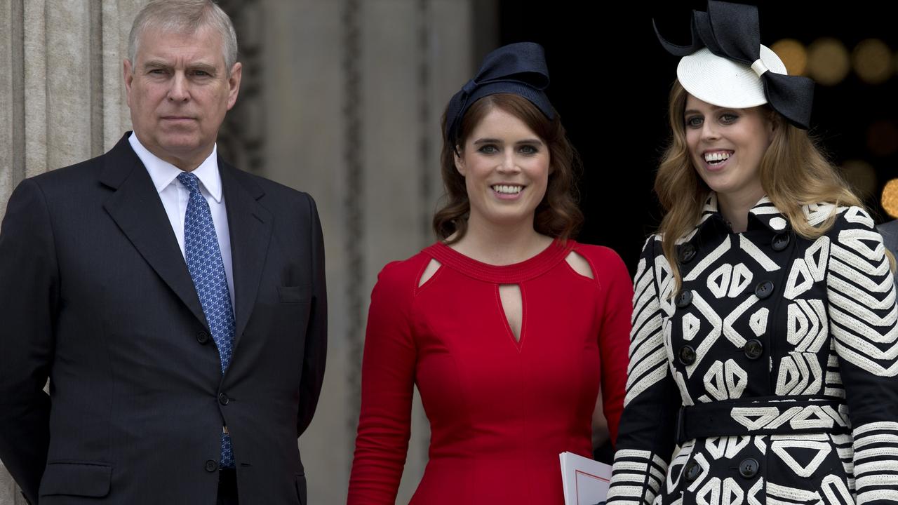 The Duke of York and his daughters, Princess Eugenie and Princess Beatrice. Picture: AFP Photo/Justin Tallis