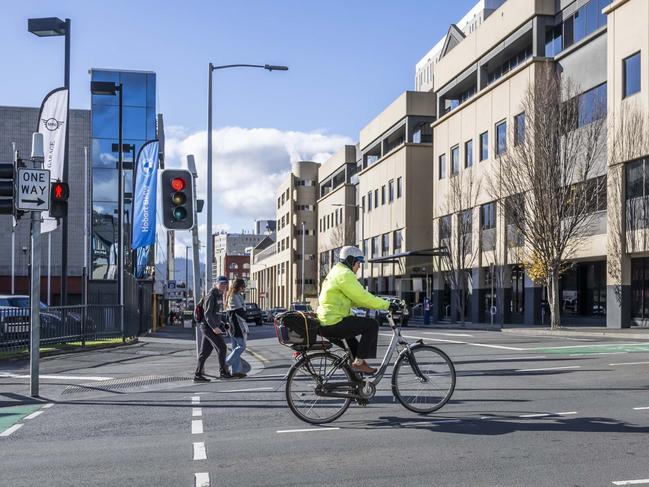 Cyclist on the intersection of Collins and Barrack Street - New bike lanes and parklets proposed. Picture: Caroline Tan