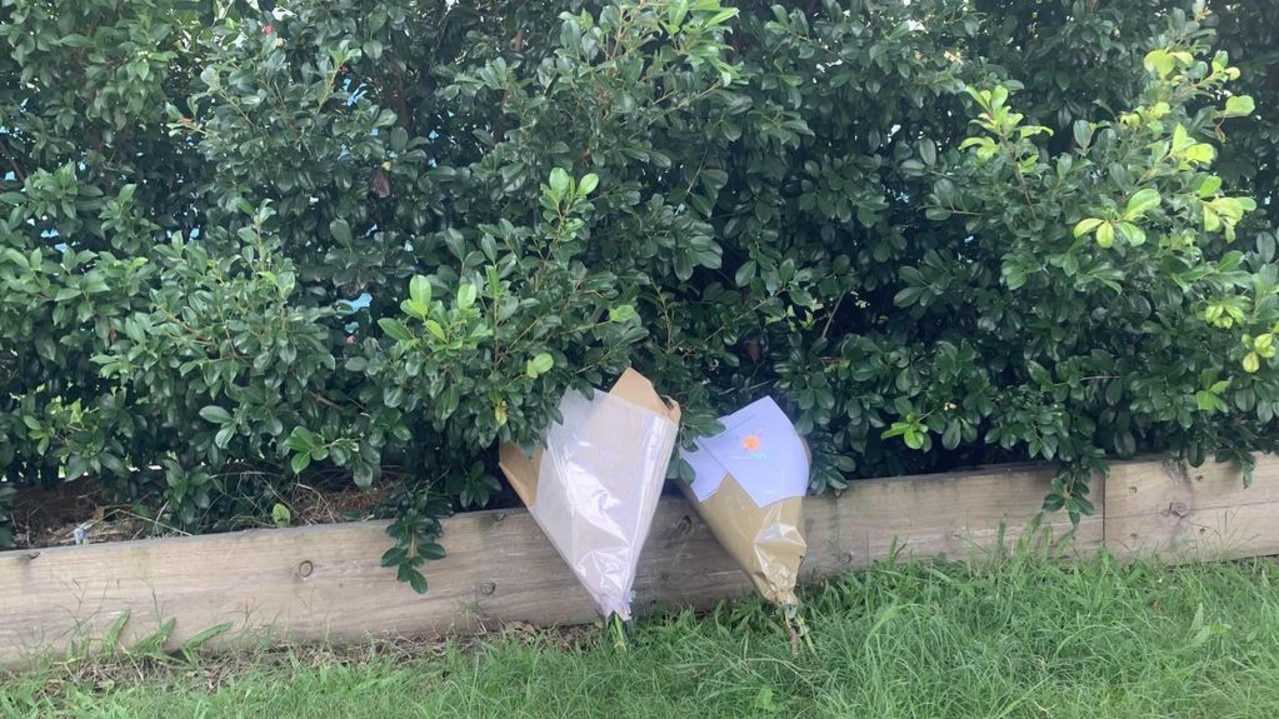 People have left flowers outside the home of a horror house fire tragedy on Monday. Picture: Supplied.