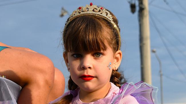 A young girl sits of the float of Maraka Queen entrant for 2004, Rachel Hallam. Photographs from the Maraka Festival Street Parade around the Ingham central business district on Saturday. In an ‘Under the Sea’-themed celebration of all things Hinchinbrook, school students, community organisations, emergency responders and contestants vying for the prized Queen and Princess titles paraded around Rotary Park in the centre of the town. Picture: Cameron Bates