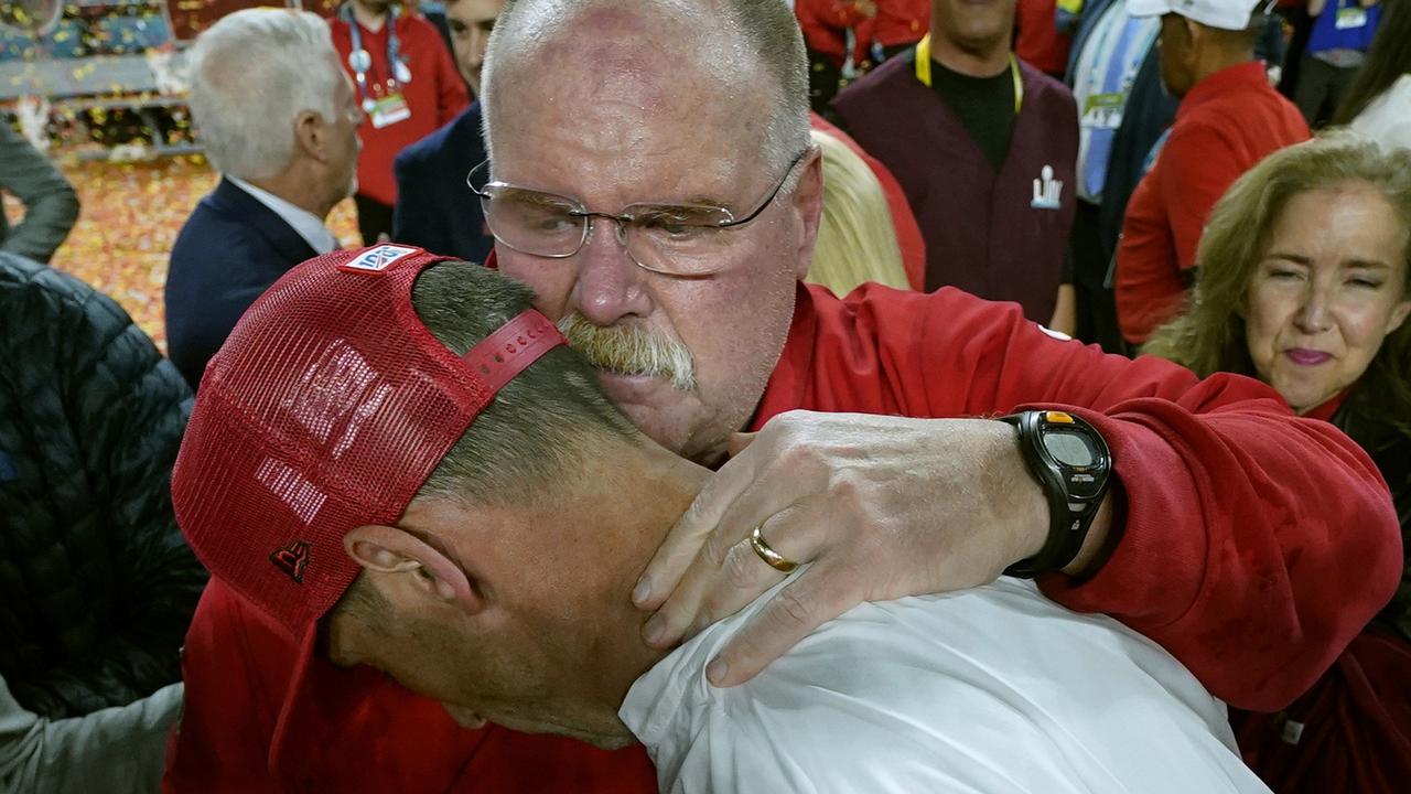 A classy moment as winning coach Andy Reid consoles Kyle Shanahan.