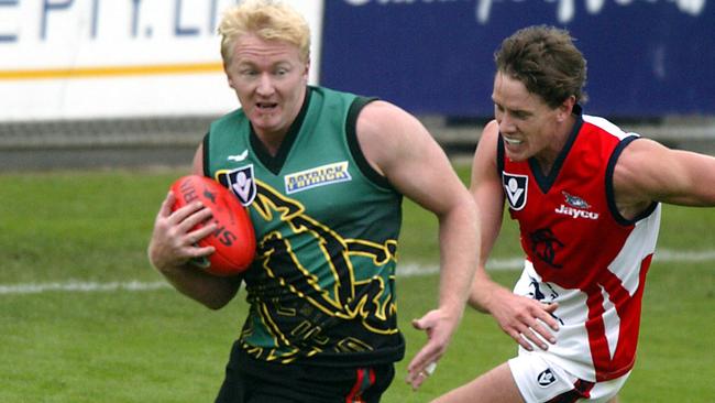 Sport Football VFL Tasmanian Devils versus Springvale Scorpions at North Hobart Oval Cameron Blight Tasmania races away from Springvale player Jason Blake